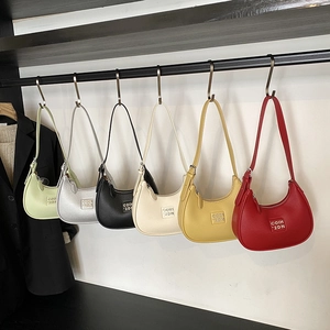 Minimalist hobo underarm bag in six vibrant colors with textured leather finish