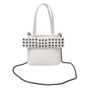 White mini handbag with studded bow detail and gunmetal chain strap on white background