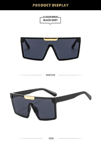 Détails de lunettes de soleil carrées oversize avec pont doré et verres gris foncé