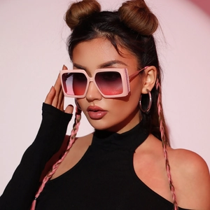 Fashionable oversized square glitter sunglasses with pink frames and gradient lenses