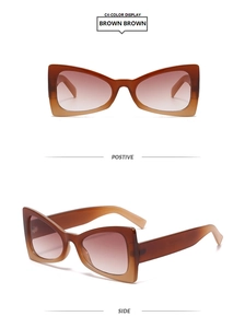 Detail view of large cat-eye sunglasses with brown gradient lenses and dark brown frame