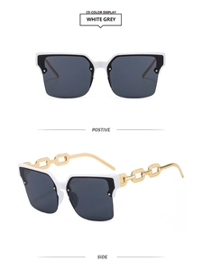 Détail des lunettes de soleil demi-cerclées avec monture blanche et branches chaîne dorée
