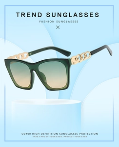 Detail view of UV400 dark green square sunglasses with hollow gold chain temples