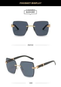 Detail of rimless square sunglasses with grey gradient lenses and golden metal accents