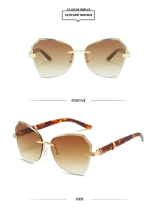 Detail view of leopard pattern temples and gradient brown lenses on rimless sunglasses