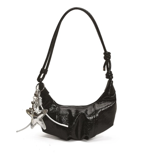 French style black crescent shoulder bag with silver star charm and knotted strap details