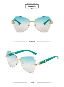 Detail of rimless geometric sunglasses with light blue gradient lenses and green temples