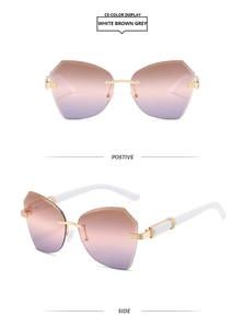 Detail view of rimless butterfly sunglasses with gradient brown lenses and gold metal temples