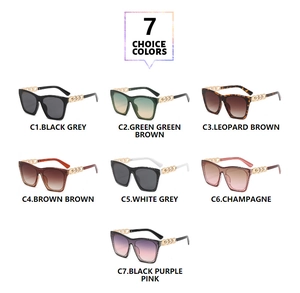 Flat lay view of square frame sunglasses showing seven color variants with gold chain arms