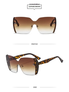 Detail view of leopard print sunglasses with gradient brown lenses and woven temple accents