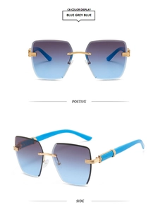 Detail view of rimless gradient sunglasses with blue lenses and gold metal temples