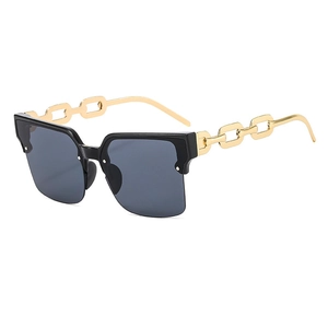 Lunettes de soleil demi-cerclées avec branches en chaîne dorée et verres foncés