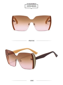 Detail of coffee brown gradient sunglasses lens with gold glitter on temple joint