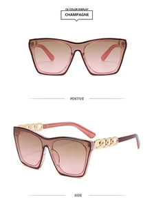 Detail of square champagne sunglasses featuring elegant golden metal chain temples