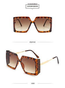 Detail view of leopard pattern square sunglasses with gold metal temples and brown lenses