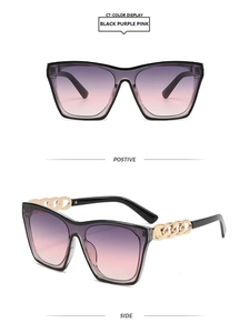 Detail of square black frame sunglasses with golden metal chain links on temple arms