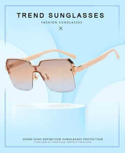 Trend sunglasses with UV400 protection and light champagne metal frames in macro detail
