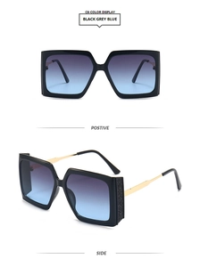Detail view of square oversized sunglasses with glitter temple and blue gradient lenses