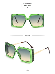 Detail view of square green transparent sunglasses with gradient lenses and gold temples