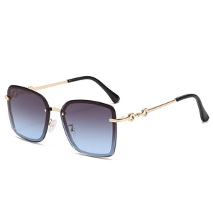 Modern oversized rimless square sunglasses with gold metal frame and gradient ocean lenses