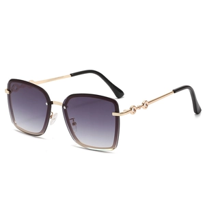 Modern oversized rimless sunglasses with purple gradient lenses and gold metal frames