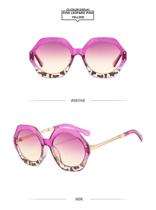 Detail view showing pink leopard frame with gold temples and gradient lenses