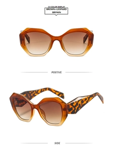 Detail of geometric sunglasses featuring brown gradient lenses and leopard print temples