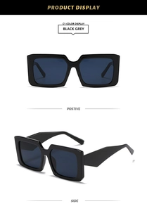 Detail view of stylish square black sunglasses showing front and side profile angles