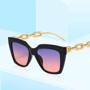 Lunettes de soleil carrées oversize avec branches chaîne dorée et verres dégradés