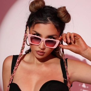 Fashionable square pink sunglasses on model with red gradient lenses in studio lighting