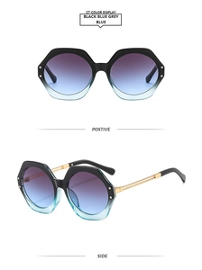 Detail of polygon sunglasses with black frames and blue-grey gradient lenses