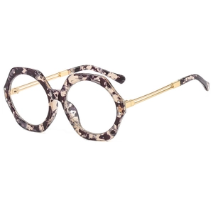 Polygonal tortoise frame sunglasses with thin gold metal temples on white background