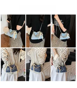 Detail shots of light and dark blue denim bucket bags with pearl chains and lace bows