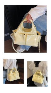 Detail of pale yellow bucket bag showing dual front pockets and glossy texture finish