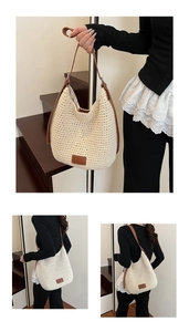 Detail view of large woven cotton bucket bag with brown leather strap and logo patch