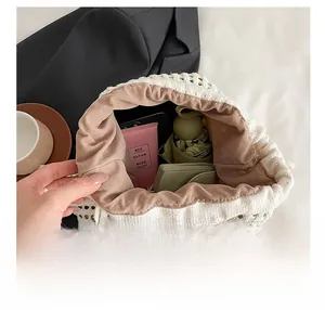 Top view of hollow knit drawstring bucket backpack showing interior space and daily essentials