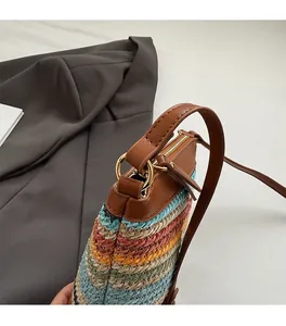 Detailed macro view of colorful woven bucket bag with premium gold metal ring hardware