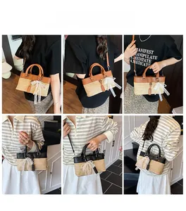 Straw tote bag with leather trim detail and a white lace bow charm accessory