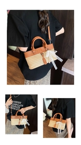 Straw tote bag with white lace bow detail and brown leather handles for versatile styling