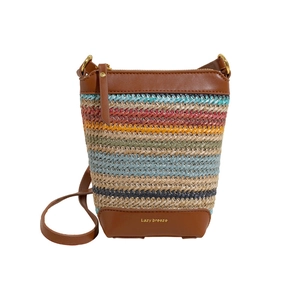 Colorful bohemian straw crossbody bag with leather trim and gold brand lettering