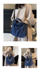 Detail of dark blue denim tote bag with silver button and raw edge seam finish