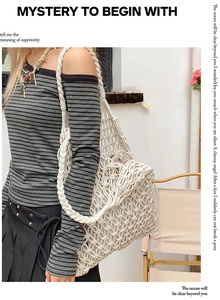 Detailed close-up of white woven hollow tote bag with intricate cotton rope knot patterns