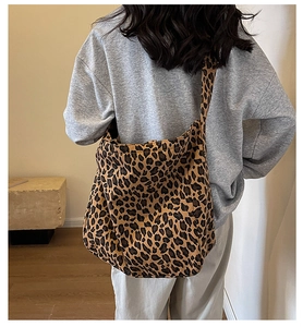 Close-up of leopard print canvas tote bag showing its large capacity and soft texture