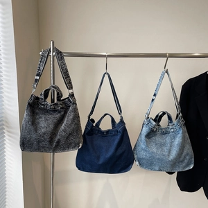 Retro denim tote bag in three washed colors with large capacity and versatile shoulder straps