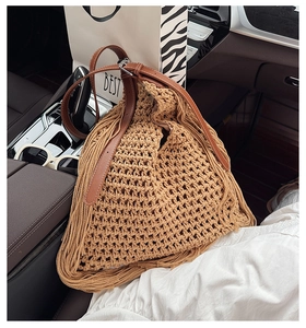 Detail of handwoven crochet bag showing hollow grid texture and leather shoulder strap