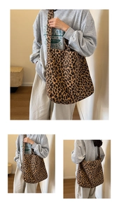 Detail of leopard print canvas tote bag showing large capacity and versatile shoulder straps