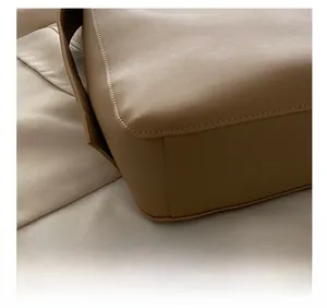 Detailed close-up showing the precision stitching on high-quality khaki leather bucket bag