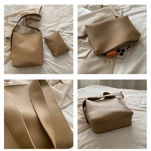 Detailed view of khaki PU leather bucket bag with matching zipper pouch and wide strap