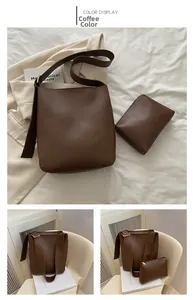 Detail view of the coffee brown leather bucket bag set with matching zipper pouch accessory