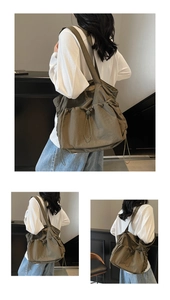 Detail view of olive green nylon tote bag featuring drawstring pleats and side pockets